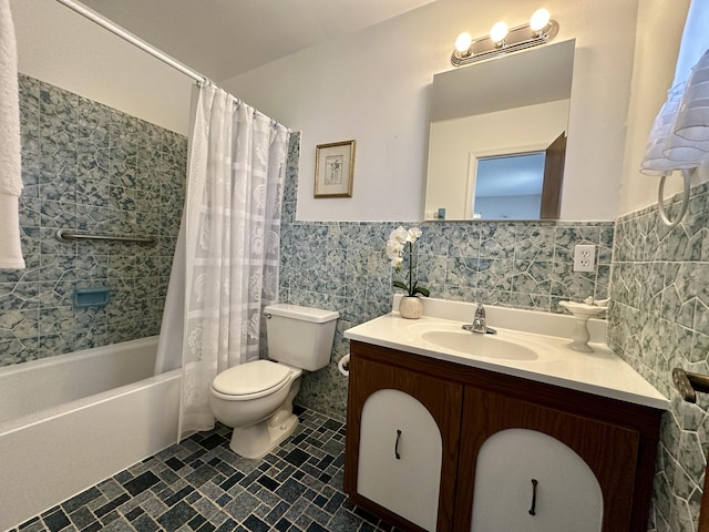 full bathroom featuring vanity, shower / tub combo with curtain, tile walls, tile patterned flooring, and toilet