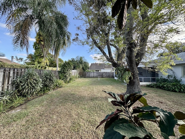 view of yard with a sunroom