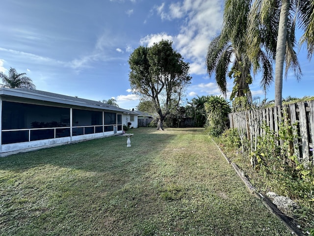 view of yard featuring a sunroom