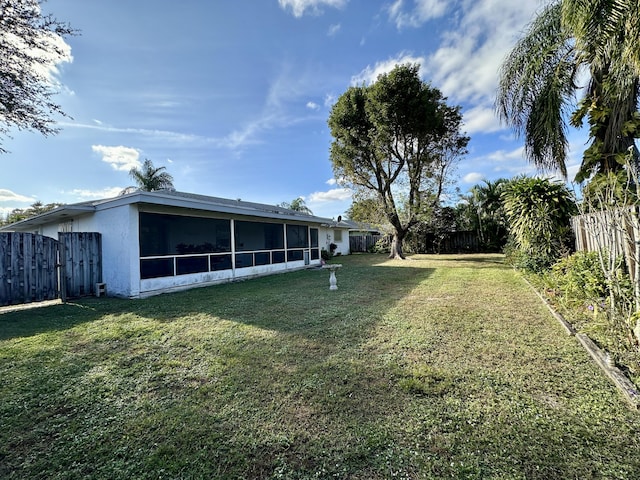 view of yard featuring a sunroom