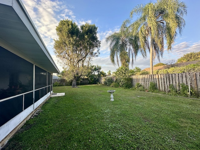 view of yard featuring a sunroom