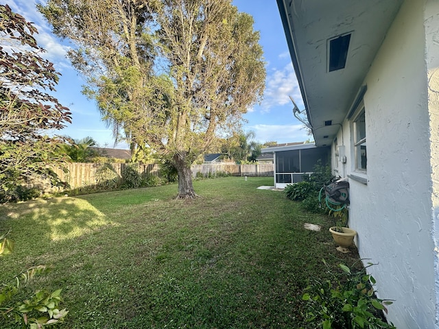 view of yard with a sunroom