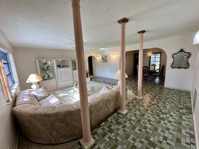 bedroom with a chandelier and decorative columns