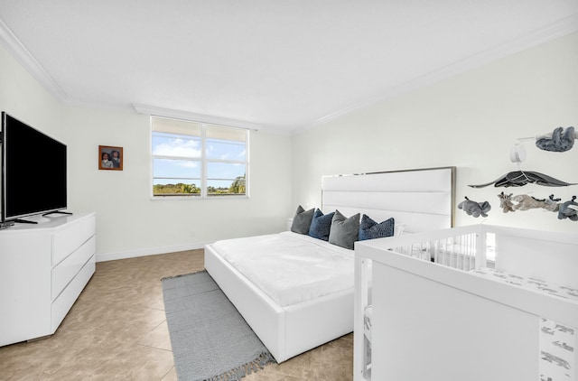 bedroom with light tile patterned flooring and crown molding