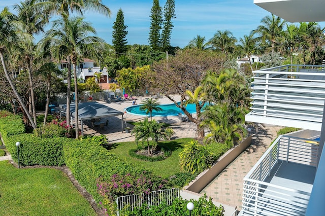 view of swimming pool featuring a patio and a lawn