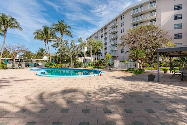 view of swimming pool with a patio