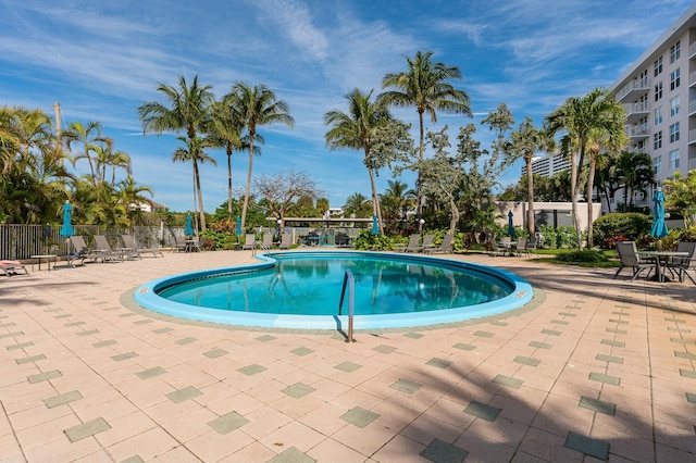 view of swimming pool with a patio