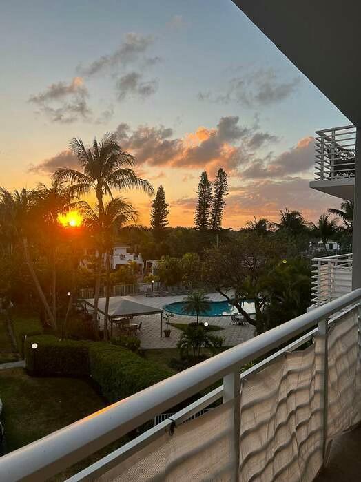 view of balcony at dusk