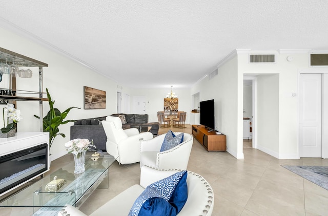 living room featuring ornamental molding and a textured ceiling