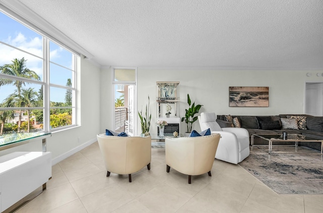 tiled living room featuring a textured ceiling and a wealth of natural light