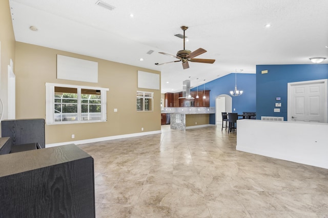 living room with ceiling fan with notable chandelier and lofted ceiling