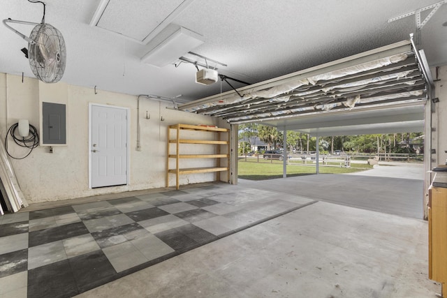 garage featuring electric panel and a garage door opener