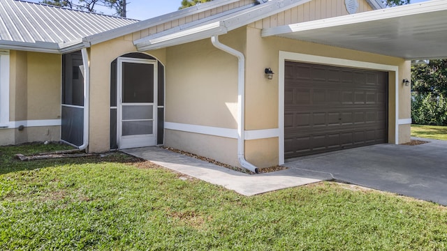 doorway to property featuring a lawn and a carport