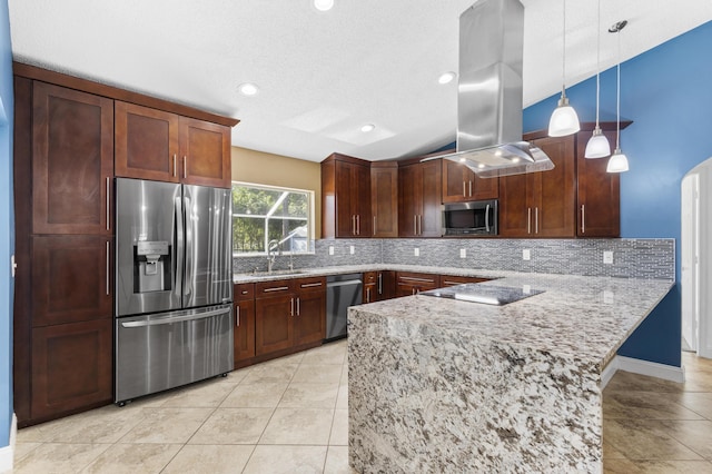 kitchen with kitchen peninsula, appliances with stainless steel finishes, tasteful backsplash, island range hood, and hanging light fixtures