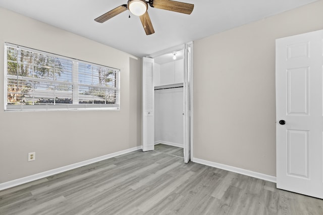 unfurnished bedroom with a closet, ceiling fan, and light hardwood / wood-style floors