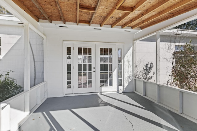 unfurnished sunroom featuring french doors