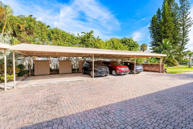 view of vehicle parking with a carport