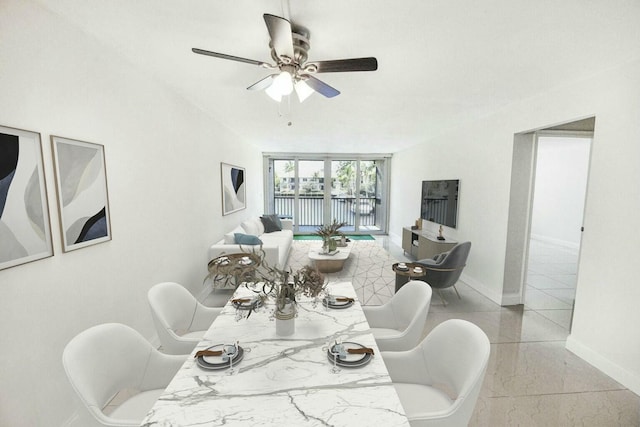 dining space featuring ceiling fan