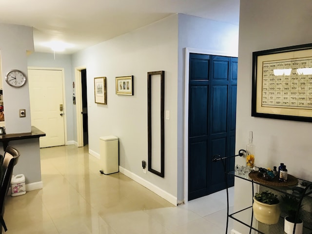 corridor with light tile patterned flooring