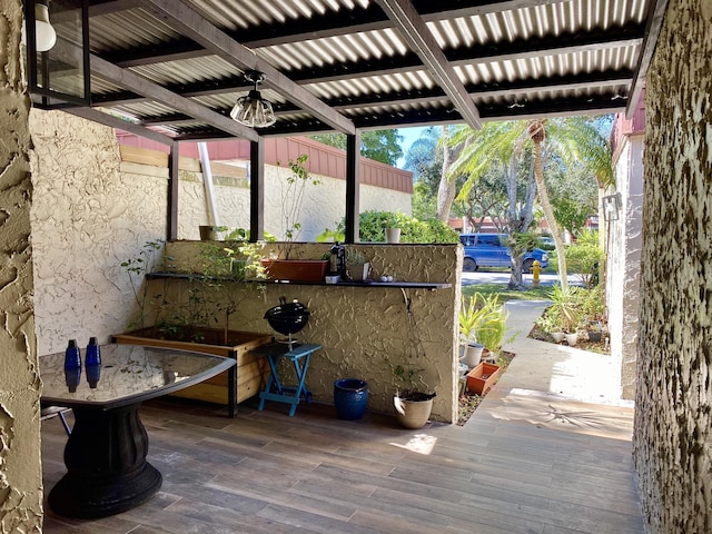 view of patio with area for grilling and ceiling fan