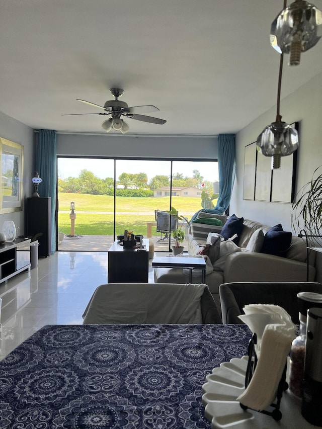 living room with ceiling fan and tile patterned flooring