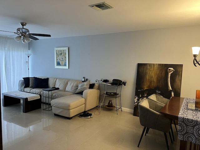 living room featuring ceiling fan and light tile patterned floors