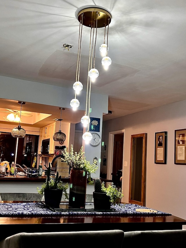 interior details featuring a tray ceiling