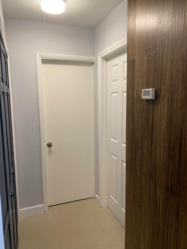 corridor with light tile patterned floors