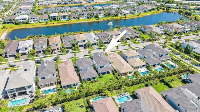 birds eye view of property with a water view