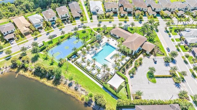 birds eye view of property with a water view