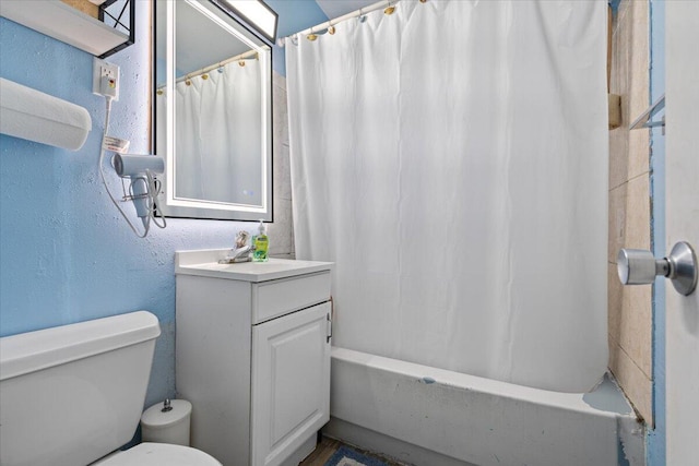 full bathroom featuring vanity, toilet, and shower / tub combo