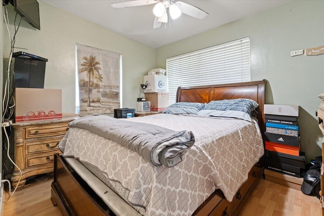 bedroom featuring light wood-type flooring and ceiling fan