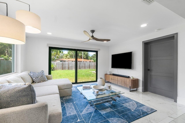 living room featuring ceiling fan