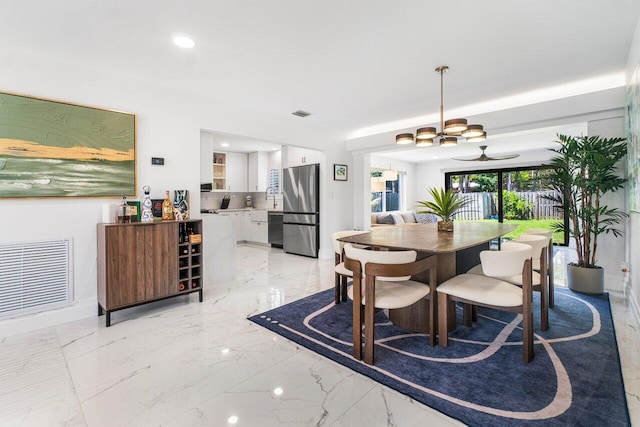 dining space featuring ceiling fan