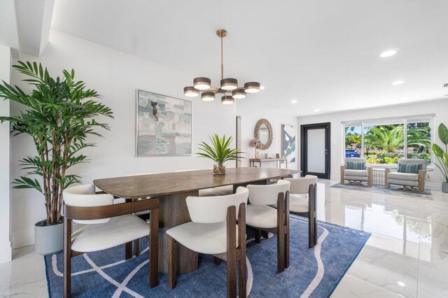 dining space with a chandelier