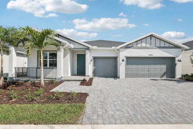 view of front of house with a garage and a porch