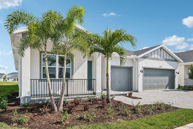 view of front of house featuring a garage and covered porch