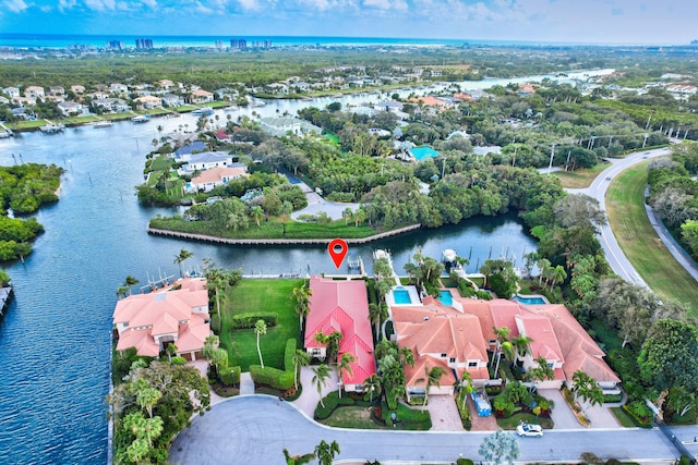 birds eye view of property featuring a water view