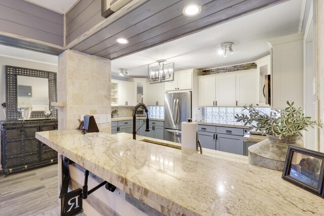 interior space featuring backsplash and hardwood / wood-style floors