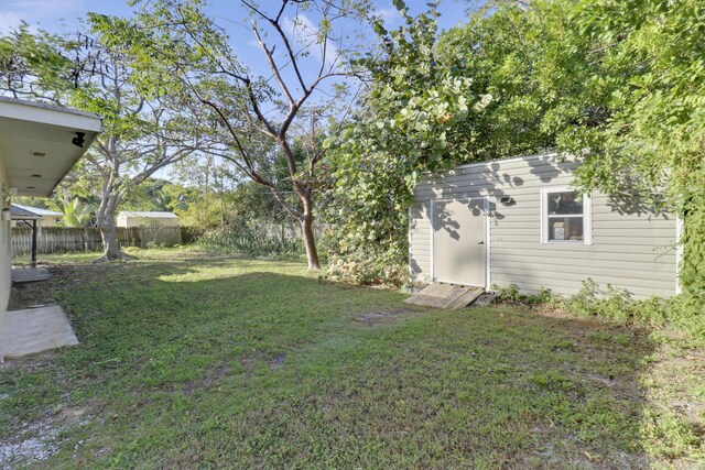 ranch-style house with a garage and a front lawn