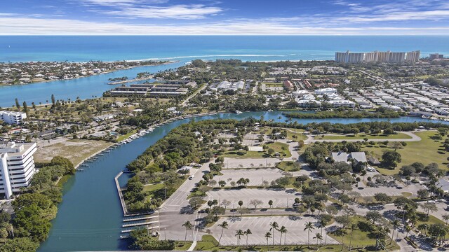 bird's eye view with a water view and a view of the beach