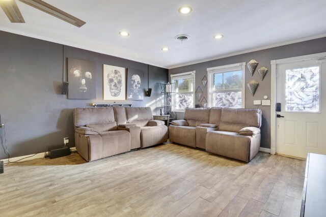 living room featuring ceiling fan and light wood-type flooring