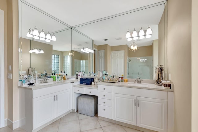 bathroom featuring tile patterned floors, walk in shower, and vanity