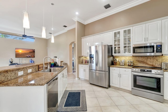 kitchen with white cabinetry, ceiling fan, stainless steel appliances, decorative light fixtures, and sink