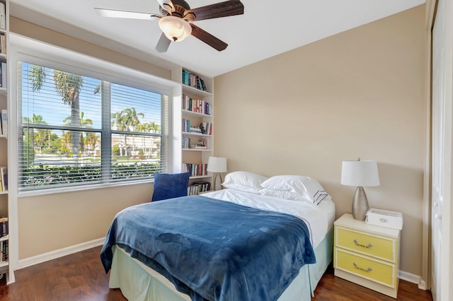 bedroom with ceiling fan and dark hardwood / wood-style floors