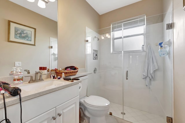 bathroom featuring walk in shower, vanity, and toilet