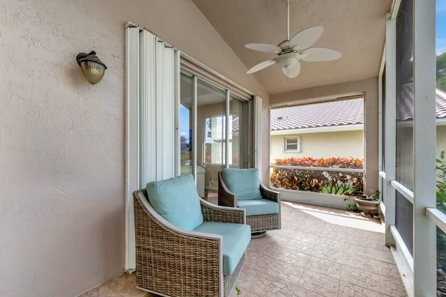 sunroom with vaulted ceiling and ceiling fan