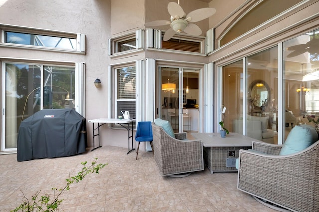 view of patio with ceiling fan and a grill