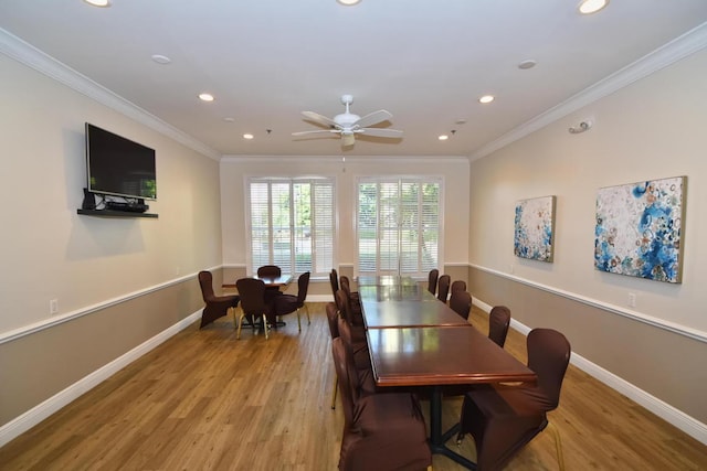 dining area with ceiling fan, light wood-type flooring, and crown molding