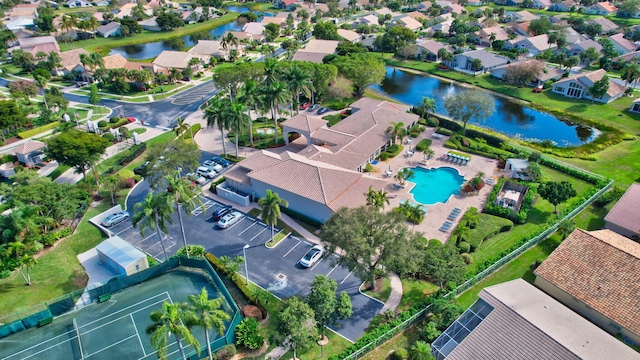 birds eye view of property with a water view